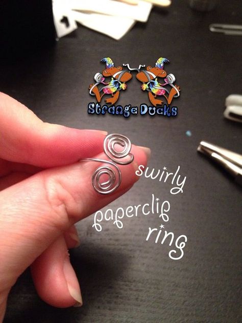 Juniors Jewelry Badge Swirly Paperclip Ring: 6 Steps (with Pictures) Junior Jeweler Badge, Paperclip Ring, Paperclip Jewelry, Junior Girl Scout Badges, Summer Camp Art, Paperclip Crafts, Beading Designs, Girl Scout Badges, Girl Scout Activities