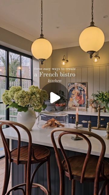 133K views · 18K likes | Elle Hervin on Instagram: "Three ways to create a classic French café vibe in your kitchen 🇫🇷🥐☕️. . 1. Vintage bistro bar stools/chairs - nothing says chic Parisian café like a Thonet or Bentwood chair 😍. 2. Art Deco-style globe lights ✨️ - the epitome of 1930s bistro décor (use on walls or over an island) 3. Vintage art prints - I adore old French art, especially the retro coffee and chocolate posters! I have several in my kitchen dining room; I think they add so much character and remind me of youthful days spent people-watching in Paris cafés 😍🙌. . . . . . . #frenchinteriors #vintagekitchen #vintagedecor" French Cafe Kitchen Theme, French Bistro Breakfast Nook, French Bistro Interior, French Bistro Kitchen, French Art Prints, Parisian Bistro Chairs, Bistro Decor, Bistro Interior, Art Deco Pendant Light