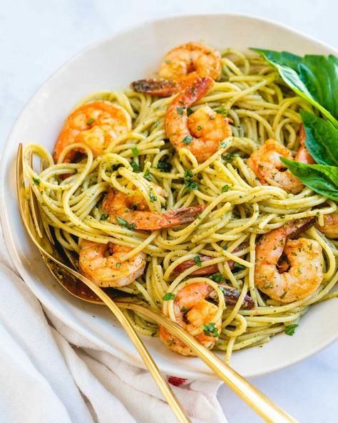 Shrimp pesto pasta is an impressively fast and easy dinner recipe! Cover the noodles in glistening green basil pesto for a meal that pleases everyone. #shrimp #shrimppesto #pestoshrimp #shrimpestopasta #pestopasta #pestorecipe #easydinner #fastdinner #healthydinner #dinneridea Shrimp Pesto Pasta Recipes, Bucatini Recipes, Fast And Easy Dinner, Shrimp Pesto Pasta, Pesto Shrimp, Pesto Pasta Recipes, Recipe Cover, Easy Dinner Recipe, Fast Dinners