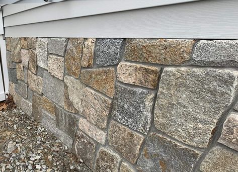 Stone Veneer Exterior Foundation, Foundation Stone Ideas, Stone Veneer Exterior Before And After, Stone Veneer Panels Exterior, Stone Skirting House, Arbor Patio, Diy Stone Veneer, Exterior Stone Veneer, Mountain House Interior