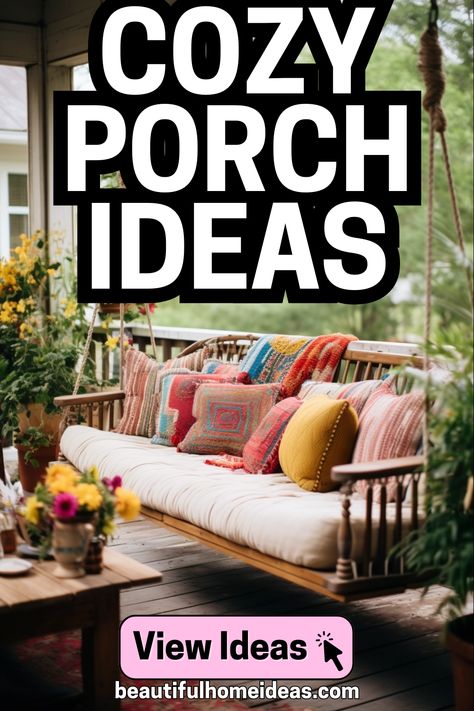 cozy porch ideas. image shows a beautiful colorful porch in the boho style. it features a hanging bench with various colorful patterned covers, in front of a rustic wooden table adorned with flowers in a vase Couch On Porch, Cozy Screened In Porch Ideas, Screened In Porch Decorating Ideas Cozy, Outdoor Porch Ideas, Dorm Room Cozy, Front Porch Seating Ideas, Cozy Porch Ideas, Cozy Porches, Tiny Porch