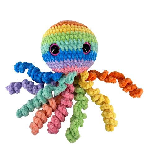 This cute fluffy  rainbow Crochet Octopus is Soft, Cuddly and can be used as a snuggle buddy.  100% handmade Octopus Plushie makes a Perfect gift or a treat to yourself.  Rainbow Octopus Plush is made  using premier yarn ,100% Micro Polyester then stuffed with premium polyester fiber fill and finished with plastic safety eyes. Size info (approximately)         Head Circumference 14-16 inches        Head to Tentacles 9-11 inches        The color might be slightly different because of lighting. Handwash or Machine wash cold, Do not exceed 40C and air dry. The stuffing has extraordinary resilience that maintains its shape and stay plush when it is washed & dried. The safety eyes has two parts to them , one is the decorative plastic portion on the outside and then a washer that snaps over the Rainbow Octopus, Octopus Amigurumi, Crochet Ladybug, Amigurumi Octopus, Octopus Plush, Crochet Octopus, Crochet Frog, Crochet Shoulder Bag, Toy Crochet