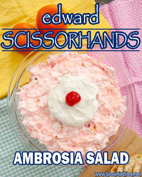 an overhead view of pink fluffy ambrosia salad topped with whipped cream and a cherry. Halloween Ambrosia Salad, Edward Scissorhands Movie Night, Pink Ambrosia Salad, Edward Scissorhands Movie, Marshmallow Salad, Ambrosia Recipe, Movie Night Dinner, Frosted Lemonade, Movie Night Food