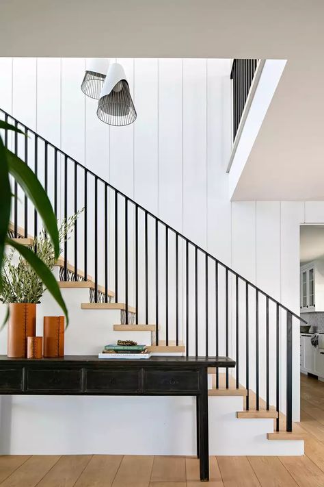 Shiplap Staircase Wall, Shiplap Staircase, Black Banister, Vertical Shiplap, Traditional Home Magazine, Modern Hanging Lights, Staircase Wall, Modern Beach, Beach Bungalows