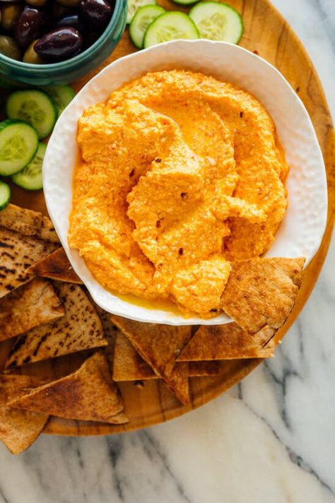 Meet your new favorite party dip! This bold and spicy roasted red pepper and feta dip is inspired by a traditional Greek recipe (htipiti). It's SO easy to make! #htipiti #greekrecipe #fetadip #roastedredpeppers #partydip #cookieandkate Red Pepper And Feta Dip, Red Pepper Feta Dip, Gf Appetizers, Mediterranean Cookbook, Dip Dip, Pepper Dip, Paleo Sauces, Greek Recipe, Spicy Dip