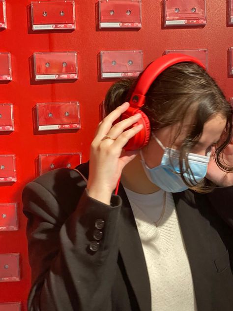 Girl looking to side holding red headphone's on her head with a red background of cassette tapes behind her Red Headphones Aesthetic, Red Headphones, Headphones Aesthetic, Iphone Theme, Girl With Headphones, I See Red, Inspo Pics, Red Aesthetic, Girl Crush