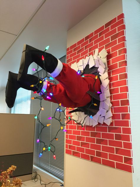 Santa crashed into our office wall! This was a witch, an idea from Dave Lowe's blog. My co-workers and myself wanted to make it a seasonal fixture at work. Office Xmas Decorating Ideas Diy, Office Theme Christmas Decor, Santas Workshop Theme Decorations Outdoor, Office Xmas Decorating Ideas For Work, Xmas Wall Decorations Diy, Santas Workshop Office Decor, Office Christmas Decorations Wall, Santa’s Workshop Office Decorations, Christmas Theme Ideas For Office