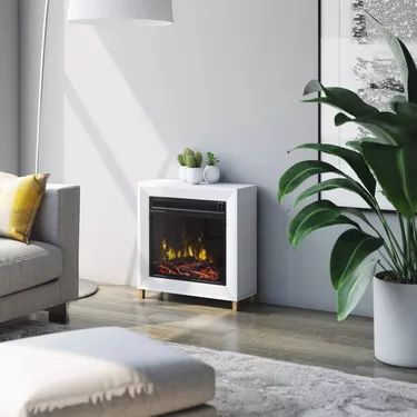 The Complete Guide to Portable Electric Fireplaces | Hunker Mantel Electric Fireplace, Small Electric Fireplace, Portable Electric Fireplace, White Electric Fireplace, Mantel Surround, Electric Fireplace Heater, Fireplace Heater, Wall Mount Electric Fireplace, Electric Fireplace Insert