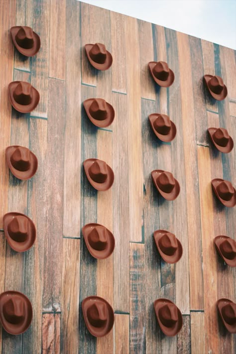 A wall lined with cowboy hats for a western welcome party Cowboys Decoration Ideas, Western Theme Photo Booth Ideas, Cowboy Hat Backdrop, Western Brand Wall, Rodeo Party Decorations Western Theme, Western Stage Decor, Wild Western Party, Vintage Western Party, Modern Western Party