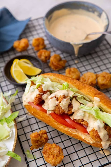 Shrimp Po' Boy Sandwich Served with Remoulade Sauce Shrimp Po Boys Recipe, Shrimp Poboys Recipe, Easy Shrimp Poboy Sandwich, Shrimp Poboy Sandwich Sauce, Poboy Shrimp Sandwich, Shrimp Poor Boy Sandwich Recipes, Fried Shrimp Poboy Sandwich, Fish Poboy Sandwich, Po Boy Sandwich Shrimp