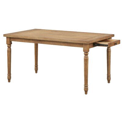 This dining table has a classic, traditional style that works so well with many design schemes. Plus, it offers storage, which we know you never have enough of. It is made from a blend of solid and engineered wood in a driftwood stain. The graceful turned legs add to the timeless appeal. What’s more, two drawers on either end - each with a simple button knob - are just right for storing placemats, napkins, or candles. This table comfortably accommodates six for a seated meal or is an ideal buffe Dining Table With Drawers, Round Extendable Dining Table, Modern Farmhouse Table, Round Wood Dining Table, Table With Drawers, Drop Leaf Dining Table, Rectangle Dining Table, Brown Table, Oak Table