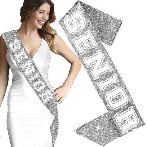 PRICES MAY VARY. PREMIUM SPARKLE SASH FOR HIGH SCHOOL & COLLEGE SENIORS! This fun sash says “Senior” in a bold Collegiate font. CELEBRATE BEING A SENIOR! It’s your final year! Celebrate in style with this fun “Senior” sash. This is NOT a piece of cheap ribbon. DESIGNED FOR THE PERFECT FIT! Our sashes are 30" long x 4" wide and made with premium satin backed sparkle fabric, they’re designed to drape perfectly across the body. BUY WITH CONFIDENCE! These sashes are made by the sash experts at Rhine Cheer Sashes Senior Diy, Senior Sash Ideas Dance, Senior Cheer Sash, Cheerleader Senior Sashes, Silver Rhinestone Party Sashes, Collegiate Font, Senior Sash, Cheap Ribbon, White Sash