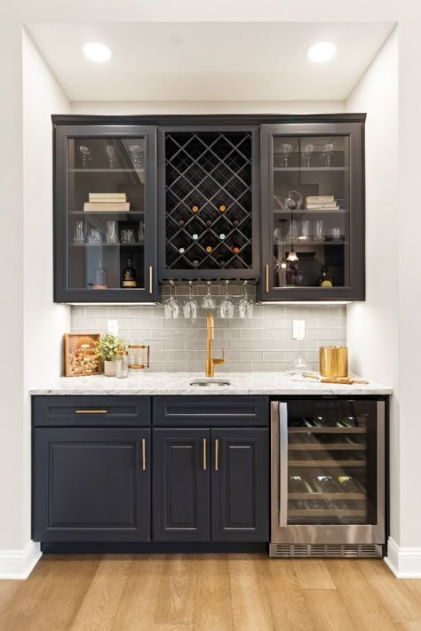 The wine bar is a popular addition for many of our homeowners, and who can blame them! We’ve designed some amazing wine bars, wine cellars, and other wine-themed upgrades in our homes. Whether you’re a seasoned sommelier or just a casual wine drinker, home is the perfect place to enjoy a glass of your favorite Cabernet. Not only will your wine bar store your bottles and glasses in a convenient, temperate location, but you’ll be able to show off your favorite vintage in a modern, sleek style. Rustic Coffee Bar, Wine And Coffee Bar, Wet Bar Designs, Home Wine Bar, Kitchen Wet Bar, Home Bar Ideas, Kitchen Remodeling Ideas, Coffee/wine Bar, Home Wet Bar