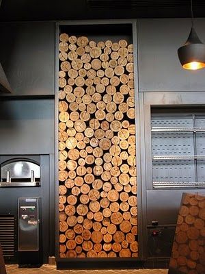 Stylish stacked log display. fab against the gunmetal grey. Create a similar effect with decorative logs from www.thelogbasket.co.uk Stacked Wood Wall, Real Wood Burning Fireplace, Log Display, Kitchen Sitting Area, Log Stools, Stacking Wood, Bread Ideas, Feature Wall Living Room, Mason Jar Chandelier