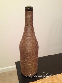 A Bride On A Budget: DIY: Twine-Wrapped Wine Bottle Centerpieces Tutorial Diy Wine Bottles, Art Deco Poster Design, Large Wine Bottle, Wedding Ideas On A Budget, Poster Design Tutorials, Wine Bottle Centerpieces, Wrapped Wine Bottles, Bottle Centerpieces, Diy Jewelry Display