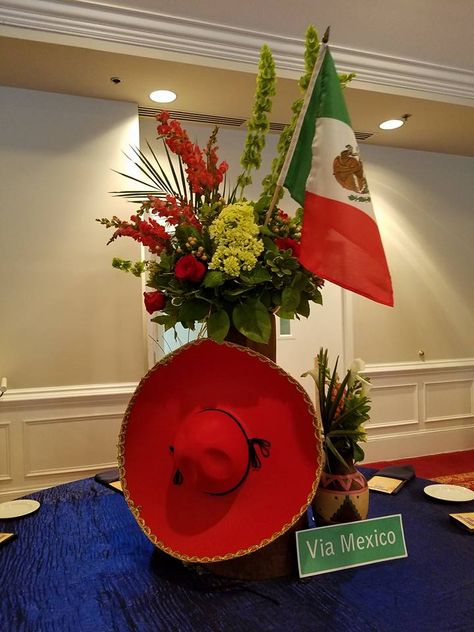 Mexico: Via Mexico ...the floral arrangements is designed in a Mexican authentic Vase with the traditional sombrero...filled with snap dragon , roses , & calla... #flowers #centerpiece #barmitzvah #mexico #roses #snapdragon #callalillies Snap Dragon, Mexican Party Theme, Dress Pictures, Fiesta Theme, 5 De Mayo, Flower Soft, Mexican Decor, Flower Arrangements Diy, Wedding Dress Pictures