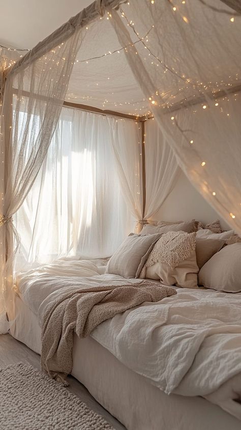 Cozy bedroom with a canopy bed, sheer curtains, fairy lights, and soft lighting in light gray, brown, and beige tones. Canopy Day Bed, Bed Drapes Canopy, Day Bed Canopy, Dreamy Bedrooms Romantic, Sheer Bed Canopy, Curtains Around Bed, Canopy With Lights, Ivy Bedroom, Bed Canopy With Lights