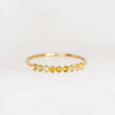 Inspired by the mystical allure of birthstones. This exquisite ring showcases 9 shimmering citrine gemstones, meticulously crafted in 14k gold. Perfect as a meaningful gift to yourself or a loved one born in November! Citrine (November birthstone) is the stone of positivity and optimism 3 deep citrine stones, each with a width of 1.75mm 6 light citrine, each with a width of 1.75mm 14k yellow gold band Citrine Birthstone Ring, Citrine Birthstone, Born In November, November Birthstone Ring, Citrine Jewelry, Casual Jewelry, Citrine Ring, Citrine Stone, November Birthstone