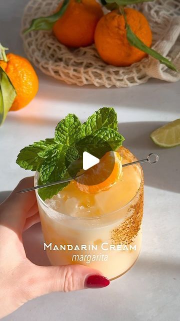 Kelly Pettit on Instagram: "Mandarin Cream Margarita 🍊☁️ a real dream of a cocktail

1 1/2 oz tequila
4-5 mandarin slices
1 oz coconut cream
3/4 oz lime juice
1/2 oz Cointreau
1/2 oz agave

Method: add mandarin slices and lime juice to a cocktail shaker and muddle. Add in the rest of the ingredients, add ice, and shake for 7 seconds. Rim a glass with agave and coconut sugar. Double strain the cocktail into the glass over ice. Garnish with fresh mint and a mandarin wedge. Enjoy!

#cocktail #cocktails #cocktailidea #cocktailideas #cocktailrecipe #cocktailrecipes #cocktailgram #cocktailtime #cocktailoftheday #margarita #tequila" Mandarin Cream Margarita, Drink Night, Margarita Tequila, Coconut Margarita, Mandarin Oranges, Boozy Desserts, Best Appetizer Recipes, 7 Seconds, Hosting A Party