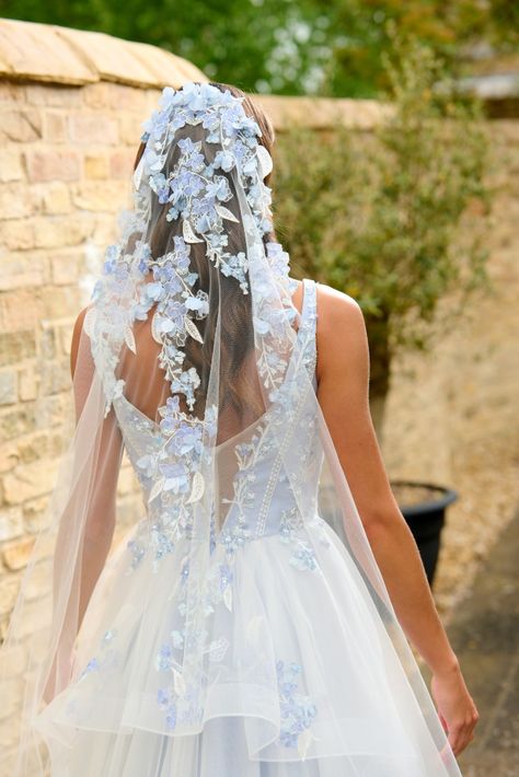 The Forget-Me-Not veil features our blue toned Hydrangea lace, growing and cascading down the veil from the comb. Tiny shimmering pearls fall down the length of this veil, and fluttering chiffon petals cover the appliques, for plenty of detail at the comb and movement as you walk. Forget Me Not Wedding Dress, Pastel Blue Wedding, Floral Veil, Flower Veil, Hydrangeas Wedding, Blue Themed Wedding, Lace Veils, Rose Lace, The Veil