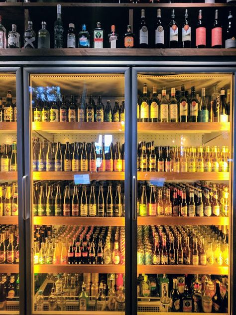 Beer refrigerator at Porvoon Paahtimo in Porvoo Finland Beer Shop Design Ideas, Beer Shop Design, Beer Collection Display, Wine Shop, Beer Bottle Collection Display, Beer Refrigerator, Beer Garden Ideas, Wine Shop Interior, Liquor Shop