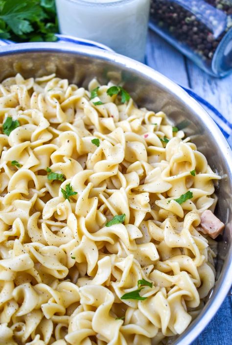 tiktok cafeteria noodles in a shallow silver pot topped with chopped parsley leaves and cracked black pepper Tiktok Recipes Dinner, Garlic Egg Noodles, Cafeteria Noodles, Buttered Noodles Recipe, Potato Wedges Recipe, Parsley Leaves, Lipton Onion Soup Mix, Sauce For Rice, Cheddar Cheese Soup