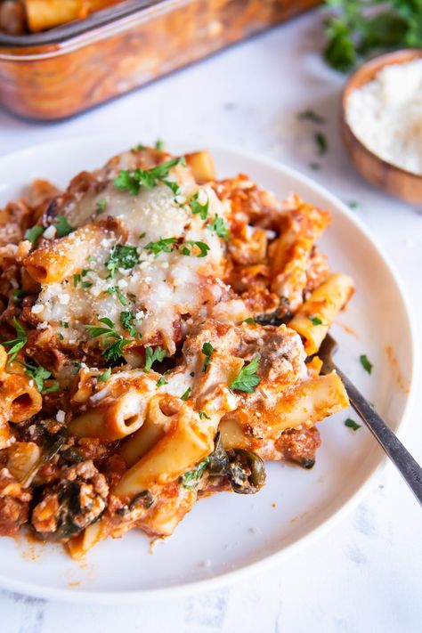 Everyone will be asking for seconds of this hearty Baked Ziti! This classic baked ziti recipe is made with sausage, ricotta and mozzarella cheese and then baked in the oven until hot, bubbly and golden brown. The perfect pasta bake for feeding a crowd! Pasta Salad Recipes Pesto, Pasta Salad Chicken, Classic Baked Ziti Recipe, Italian Sausage Marinara, Classic Baked Ziti, Zesty Pasta Salad, Sausage Ricotta, Recipes Pesto, Sausage Marinara