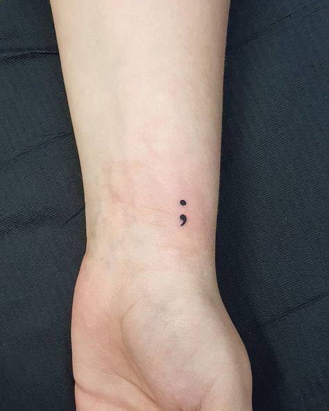 51 Semicolon Tattoos On Wrist You Should Always Think Check more at https://imagestag.com/51-semicolon-tattoo-on-wrist/ Dot Comma Tattoo, Small Semicolon Tattoo Wrist, Dot And Comma Tattoo, Semi Colon Tattoo Wrist, Semicolon Tattoo On Wrist, Simple Semicolon Tattoo, Semi-colon Tattoo Ideas Wrist, Ocd Tatoos Design, Tattoos For Ocd