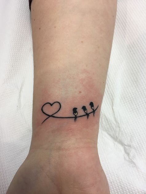 Small Wrist Tattoos Family, 2 Love Birds Tattoo, Small Love Bird Tattoo, 4 Small Birds Tattoo, Bird With Heart Tattoo, 3 Birds On A Wire Tattoo, Three Little Birds Tattoo, Wrist Tattoos Family, Family Heart Tattoos