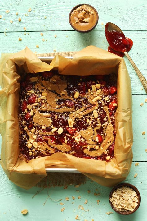 EASY Gluten-Free Vegan PB&J Bars! A simple oat-walnut crust, jammy and peanut buttery filling! SO tasty #vegan #glutenfree #pbj #peanutbutter #snack #healthy #minimalistbaker Jelly Bars, Walnut Crust, Hearty Snacks, Almond Crusted, Minimalist Baker, Snack Bars, Peanut Butter And Jelly, Peanut Butter Jelly, Easy Healthy Breakfast