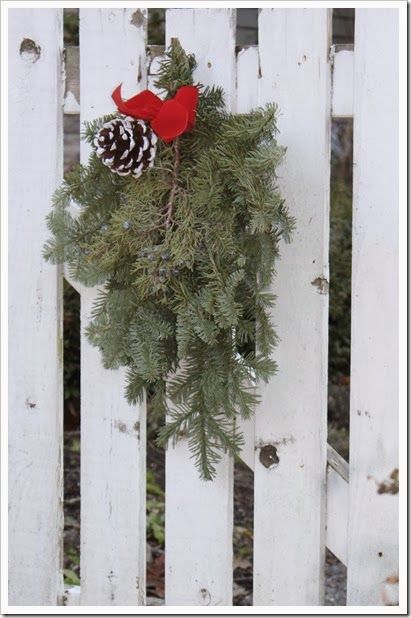 Christmas decor on the picket fence gate Christmas Wreath On Fence Gate, Christmas Picket Fence Decor, Picket Fence Christmas Ideas, Christmas Fence Decor, Christmas Greenery Decor, Door Painting Ideas, Christmas Fence, Sliding Gate Design, Gate Design Modern