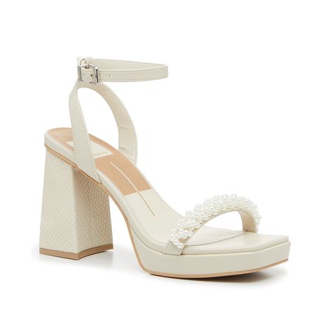 Dolce Vita-Alesia Sandal From bridal showers to brunch, the Alesia sandal adds a stylish touch to any look. This two-piece pair from Dolce Vita is complete with a subtle snake print heel, faux pearls along the strap, and a modern squared off toe detail. Complete with a delicate ankle strap to keep your steps secure. Dolce Vita Pearl Heels, Unique Bride Shoes, Wedding After Party Shoes, Pearl Strap Heels, Beach Wedding Heels, Chunky Bridal Heels, Boho Wedding Heels, Cute Hoco Heels, White Heels With Pearls