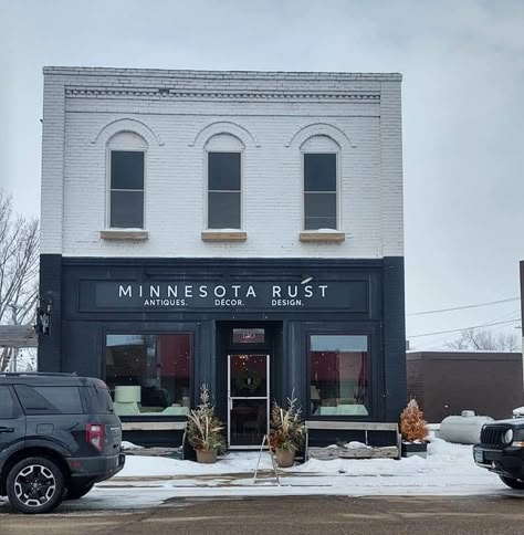 Small Town Buildings Main Street, Main Street Building Facade, Painted Brick Business Exterior, Black And White Exterior Commercial Building, Painted Brick Store Fronts, Brick Store Front Ideas, Business Exterior Store Fronts, Painted Brick Building, Brick Business Exterior