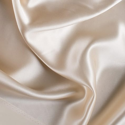 Introducing a top quality Premium Tapioca Silk Charmeuse made especially for Mood. Of a medium weight, this superb silk features an exquisite drape along with a lovely sheen. Silk charmeuse fabrics are the ideal material for classic gowns, dresses, blouses, and lingerie. They make superior linings as well. Available in 95+ attractive shades. 

Note: Dye lots are subject to change up to 10% in either direction. Ordering swatches is HIGHLY recommended for these products. Fabric Photography, Cream Aesthetic, Mood Fabrics, Neutral Aesthetic, Gold Aesthetic, Beige Aesthetic, Silk Charmeuse, Brown Aesthetic, White Aesthetic