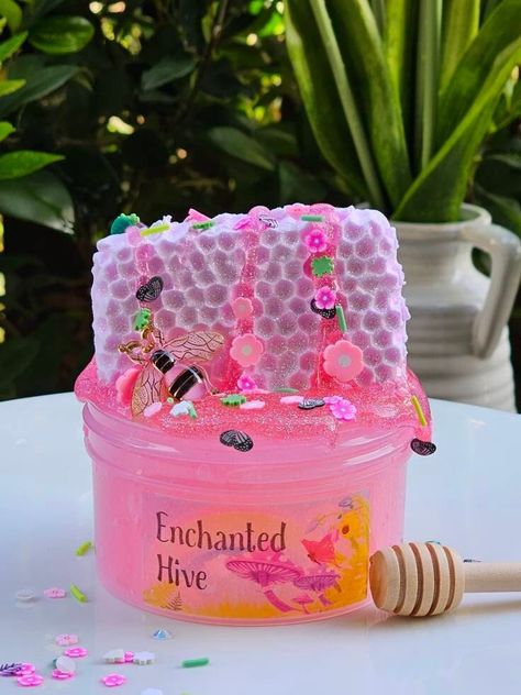 This name of this Slime Kit is perfect for spring! This is what I imagine an enchanted fairy garden hive would look like.  Comes With: Super fun Jelly slime base, with a realistic light pink clay honeycomb piece. Also comes with a pink and gold bee charm, whimsical spring garden sprinkles, a green leaf, and a 1oz pink clear Slime with holographic glitter.  Scented: Pinkest Coconut Calypso with a hint of strawberry. Enchanted Fairy Garden, Slime Collection, Clay Slime, Easter Gift For Kids, Pretty Slime, Jelly Slime, Playing With Slime, Slimy Slime, Slime For Kids