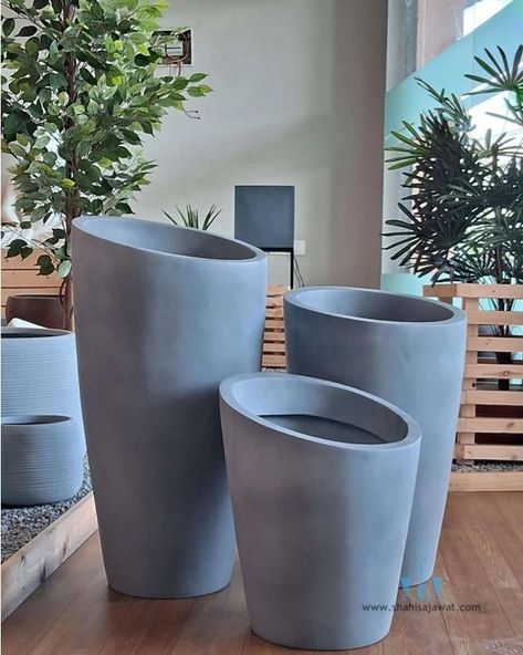 The Abstract Light Grey Vase Shaped FRP Planter With Its Handcrafted Matte Finished Body And Clean Lines Adds A Unique And Minimalistic Touch To Any Spaces. Showcase Your Favorite Plants In Style And Bring A Touch Of Natural Charm To Your Interior. Using Fiberglass Planters In Your Plantscaping Designs Is A Great Way To Enhance The Beauty Of Any Indoor Or Outdoor Landscape. Their Durable, Commercial Grade Construction And Vast Color Choices Make Fiberglass Plant Containers An Interiorscape An... Grey Vase, Grey Vases, Plant Containers, Large Flower Pots, Fiberglass Planters, Outdoor Landscape, Vase Shapes, Large Pots, Outdoor Landscaping