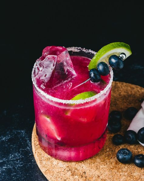 Got berries? Try this fresh Blueberry Margarita recipe! This impressive spin on the classic is bright purple and deliciously tangy. #blueberry #blueberrymargarita #margarita #margaritarecipe Blueberry Pomegranate Margarita, Berry Margarita, Blueberry Margarita, Pomegranate Margarita, Classic Margarita, Margarita Recipe, Drinks To Try, Margarita Recipes, Bright Purple