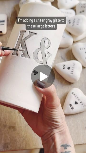 Gitti Lindner- Cinder Ceramics on Instagram: "Here’s part two on glazing stamped images or letters on a ceramic piece. This is done in the bisqueware stage after the first firing. 
The tips are in the video 🖤
.
.
.
#handmade #personalized #customized #ceramics #ceramicist #pottery #clay #smallbatch #handmaker #keramik #ceramic #glazingpottery #glazing" Lettering On Ceramics, Pottery Wedding Gifts, Ceramic Letters, Pottery Projects, Letter Stencils, Painted Letters, Pottery Clay, Glazes For Pottery, Black Letter