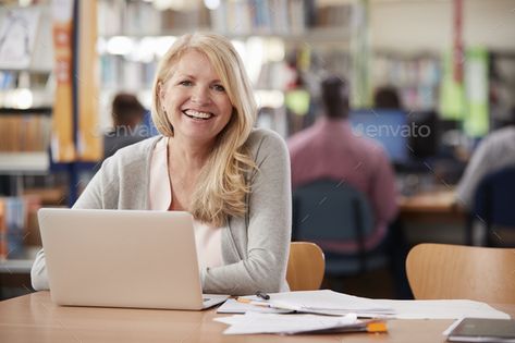 Portrait Of Mature Female Student Using Laptop In Library by monkeybusiness. Portrait Of Mature Female Student Using Laptop In Library#Female, #Mature, #Portrait, #Student Laptop Learning, College Computer, Uk University, Computer Education, Teacher Teaching, People Person, Female Teacher, Uk Universities, Student Accommodation