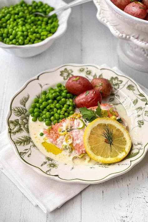 This Irish Baked Salmon recipe is deliciously fresh and easy to make with Irish flavorings and simply baked in a foil packet on a sheet pan. The drizzle of Dill Cream Sauce, which almost makes itself, is utterly divine and easy. Dill Cream Sauce, Salmon Vegetables, Baked Salmon Recipe, Irish Cooking, Irish Recipes Traditional, Creamed Leeks, Foil Packet, Irish Stew, Baked Salmon Recipes