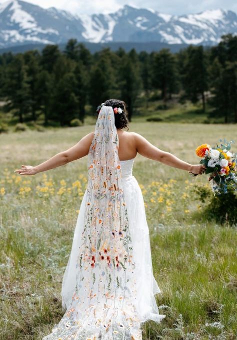 This is a duplicate listing of my wildflower veils with just the Orange Wildflower tulle, as it has become so popular.  *Mountain wedding photos showcase a 240cm wildflower veil in orange. Photos taken by the talented www.sweetjusticephoto.com (Colorado US). *70's styled photoshoot (further details below) photography by the wonderful  www.tonypullenphotography.co.uk (Rochester UK) This stunning floral veil is perfect for any wedding or celebration. Scattered with embroidered wildflowers and leav Boho Wildflower Wedding Dress, Wedding Dress With Embroidered Veil, Embroidered Wildflower Veil, Wild Flower Veil Wedding, Wildflower Wedding Dresses, Wedding Floral Veil, Alternative To Veil, Flower Embroidered Wedding Veil, Bridal Veil With Flowers