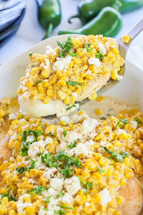 BEST Chicken Dinner EVER! This recipe is SO easy and SO delicious! Mexican Street Corn is smothered over tender chicken breast and baked to perfection. The best easy chicken dinner we have had in a long time! Street Corn Chicken, Corn Chicken, Chicken Breast Crockpot Recipes, Crockpot Chicken Breast, Mexican Side Dishes, Chicken Breast Recipes Baked, Mexican Street Corn, Easy Chicken Dinner Recipes, Spicy Dishes