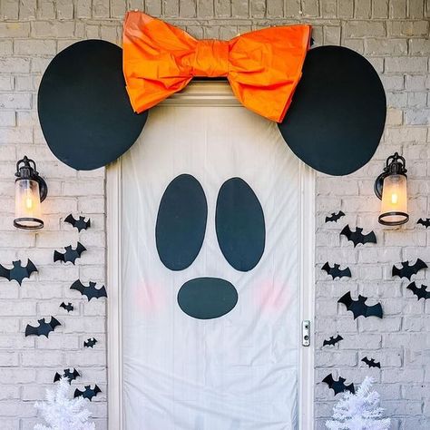 Ginny Phillips | Magical Family Lifestyle ✨ on Instagram: "October is boo-tiful 👻🦇 Happy October, friends! Here’s a look at our spooky season inspired porch I did over the weekend 🖤 Minnie ghost is definitely the center of attention (she she should be) and I adore my candy corn trees and blow molds 🥰 AND I’ll be showing you how to make the candy corn topiaries for ✨five dollars each✨ later this week! Have you bought your mums yet this year? There’s something about them that always feels ch Disney At Home, Disney Halloween Decorations, Blow Molds, She She, Boo Tiful, October Halloween, Happy October, Outside Decorations, Front Porch Decor