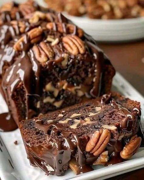 Gooey Chocolate Pecan Dream Cake  ￼ Ingredients: 1 cup unsalted butter, softened 1 cup granulated sugar 1 cup brown sugar, packed 4 large eggs 1 teaspoon vanilla extract 2 cups all-purpose flour 1/2 cup cocoa powder 1 teaspoon baking powder 1/2 teaspoon baking soda 1/2 teaspoon salt 1 cup sour cream 1 cup pecans, chopped 1/2 cup chocolate chips 1/2 cup heavy cream 1/2 cup dark chocolate, chopped Extra pecans for garnish  Directions: Preheat the oven to 350°F (175°C) and grease a loaf pan.  In a large bowl, cream together the butter, granulated sugar, and brown sugar until light and fluffy.  Add the eggs one at a time, beating well after each addition, then mix in the vanilla extract.  In a separate bowl, whisk together the flour, cocoa powder, baking powder, baking soda, and salt.  Gradual Optimal Recipes, Pecan Cake, Chocolate Pecan, Dream Cake, Loaf Cake, Cake Ingredients, Decadent Desserts, Pecans, Chocolate Desserts