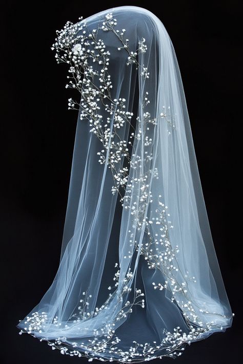 Wedding veil design. White tulle with baby's breath and crest embroidery.

Are you a soon-to-be bride looking for unique ways to switch up traditional wedding styles? Sink your curious eyes into our extensive list of finely-decorated embroidered wedding veils, bound to add a personal touch to your big day. No longer is the veil just a simple sheer fabric, it's your…

Read more: https://tastywed.com/generated-post-38-detailed-embroidered-wedding-veil-collections/ Moon Phase Veil, Celestial Veil Wedding, Non Traditional Wedding Veil, Non Traditional Veil, Unique Veils Wedding, Colorful Veils, Moon Veil, Traditional Wedding Styles, Wedding Veil Ideas