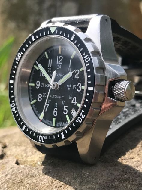 A rugged looking military watch with a black dial and a chunky crown. Marathon Watch, Swiss Automatic Watches, Big G, Divers Watch, Military Watches, Search And Rescue, Swiss Made, Automatic Watch, Breitling Watch