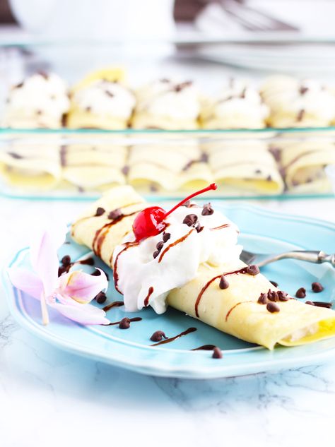 Cannoli Crepes are such a fun way to sweeten up your next brunch and are so much easier than making a cannoli.  They are stuffed with a ricotta cheese filling with mini chocolate chips and maraschino cherries mixed in.  Top them with whipped cream and chocolate sundae sauce for a decadent treat everyone is sure to swoon...Read More » Cannoli Crepes, Decadent Breakfast, Cheese And Chocolate, Chocolate Sundae, Mothers Day Desserts, Breakfast Crescent Rolls, Best Italian Recipes, Breakfast Pastries, Filling Breakfast