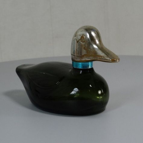 Add some vintage charm to your collection with these Avon perfume and after shave decanters! From a green Mallard Duck to a Sherlock Holmes Bulldog Pipe, these bottles are perfect for display or everyday use. #Avon #Vintage #Perfume #AfterShave #Decanter #Bottle #DucksAndChicks #Bulldog #ElectricCharger #StanleySteamer #WildCountry #Glass #MadeInTheUSA  #Bulldog #Whitemilkglass Green Perfume, Avon Perfume Bottles, Duck Green, Cologne Bottle, Avon Collectibles, Avon Perfume, Avon Vintage, Mallard Duck, Ding Dong