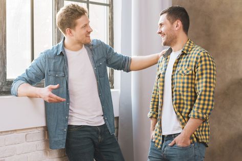 Two smiling young men talking to each other Photo | Free Download Two People Talking Aesthetic, Person Talking Reference, Personal Financial Management, Men Standing, Hand Shake, Guy Talk, Hands Photos, Shaking Hands, Business Woman Successful