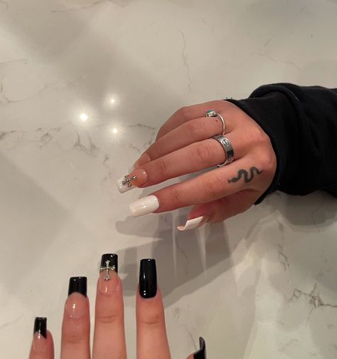 black and white chrome heart nails with cross detail🖤 insta//kimmieeoconnor Acrylics With Cross, Nails With Cross Design Acrylic, All Black Nails With Gems, White Nails Cross, Nails With Cross Gems, Nail Designs With Crosses, Nail With Cross, One Hand White One Hand Black Nails, Chrome Hearts Nails Short